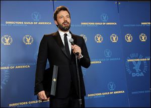 Ben Affleck speaks holds his award for outstanding directorial achievement in feature film for 