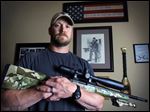  Former Navy SEAL and author of the book ‘American Sniper,’ Chris Kyle poses in Midlothian, Texas, in 2012. He was found dead at a shooting range on Saturday.