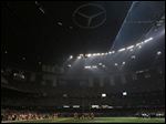  Players huddle on the field during a Superdome power outage in the second half of Super Bowl XLVII, Sunday, in New Orleans.
