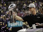  Baltimore Ravens coach John Harbaugh holds the Vince Lombardi Trophy as he celebrates his team's 34-31 win against the San Francisco 49ers in Super Bowl XLVII on Sunday in New Orleans.
