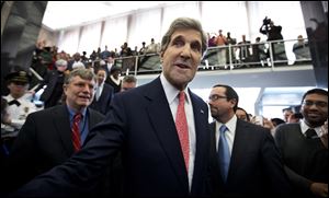 New Secretary of State John Kerry is greeted by State Department staff during a ceremony welcoming him as the 68th secretary of state, today.