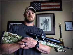 Former Navy SEAL and author of the book ‘American Sniper,’ Chris Kyle poses in Midlothian, Texas, in 2012. He was found dead at a shooting range on Saturday.