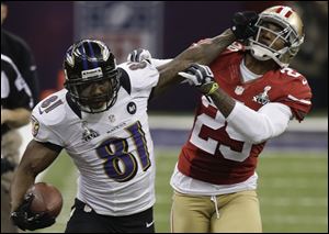 Baltimore Ravens wide receiver Anquan Boldin stiff-arms San Francisco 49ers cornerback Chris Culliver during the Super Bowl. Boldin had 104 receiving yards and a touchdown.