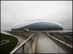  The outside view of the Bolshoy ice dome, main ice hockey arena, at the Russian Black Sea resort of Sochi The Olympic stadium is seen under construction.