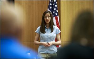 Defendant Jodi Arias takes the stand before testifying during her murder trial in Superior Court in Phoenix. Arias is accused of murdering her lover, Travis Alexander.