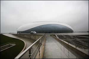 The outside view of the Bolshoy ice dome, main ice hockey arena, at the Russian Black Sea resort of Sochi The Olympic stadium is seen under construction.