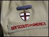  A Boy Scout uniform featuring a God and Country medal.