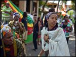  Bob Marley's granddaughter Donisha Prendergast, right, dances to the sound of a Rastafarian drum, during the celebration of Marley's 68th birthday today in the yard of his Kingston home, in Jamaica.