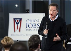 Ohio Gov. John Kasich speaks during a panel discussion with small business owners at Service Spring Corp in Maumee.