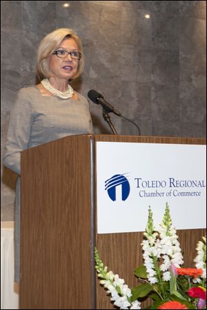 Morgan Ballas speaks as she accepts the Athena award at the Toledo Regional Chamber of Commerce annual meeting.