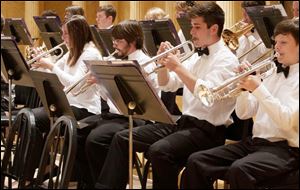 Trumpet players of the Toledo Youth Orchestra prepare for a concert.
