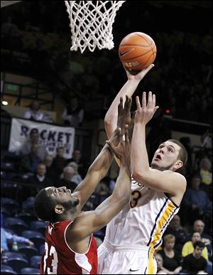 Miami's Will Felder guards Toledo's Nathan Boothe, who hit the game-winning 3 at the buzzer on Wednesday night at Savage Arena to help the Rockets win their fourth straight.