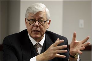David Keene, president of the National Rifle Association, speaks during an exclusive interview with Associated Press reporters in Denver.