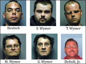 Michael Deutsch, 37; Shawn Wymer, 27; Terrance Wymer, 28; Mike Wymer, 54; and Gary Wymer, 55, were arrested and charged with transportation of stolen property, according to the FBI. An arrest warrant with the same charge was also issued for Robert Debolt, Jr., 47.