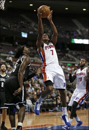 Detroit Pistons guard Brandon Knight (7) drives against Brooklyn Nets forward Gerald Wallace.