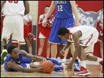  Bowling Green's sophomore LaMonta Stone (11) looses control of the ball as Anthony Wayne's senior Ose Omofoma (22) reaches in.