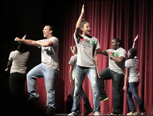 Trey Loescher, left, a senior at Bowling Green High School, and Marissa Avery, a junior, perform with other Black Culture Club members before Bowling Green middle and high school students. The assembly was part of the school district’s recognition of Black History Month.