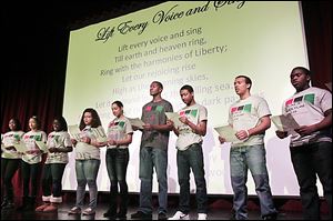 Bowling Green middle and high school students who are members of the Black Culture Club present African-American history information to their peers during an assembly Friday.