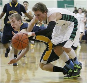 Toledo Christian School player Eric Cellier, 5, and Ottawa Hills High School player Blake Pappas, 1, battle for a loose ball.