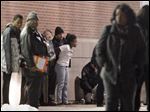  Fans leave the gym after a fight in Scott High School during the Scott v. Rogers basketball game Friday.