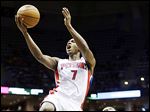  The Pistons' Brandon Knight shoots over Milwaukee's Brandon Jennings during the first half.