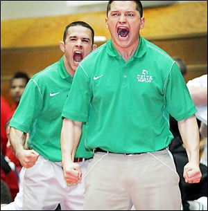Delta coaches Anthony, left, and Danny Carrizales react to a pin during the team's semifinal match.