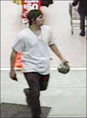 Surveil-lance shows a suspect leaving Walmart in Adrian after allegedly stealing an in-dash stereo system.