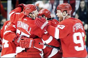 The Red Wings’ Niklas Kronwall celebrates a goal with Johan Franzen (93) and other teammates in the third period against the Edmonton Oilers on Saturday.