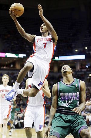 The Pistons' Brandon Knight shoots over Milwaukee's Brandon Jennings during the first half.