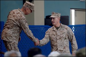 U.S. Marine Gen. Joseph F. Dunford, right, shakes hand with outgoing NATO commander U.S. Gen. John Allen, left, during a change of command ceremony at the ISAF headquarters in Kabul, Afghanistan, today. Dunford takes charge at a critical time for President Obama and the military as foreign combat forces prepare to withdraw by the end of 2014.