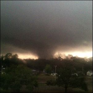 This photo provided by Jordan Holliman shows a tornado moving through Hattiesburg, Miss., on Sunday. Emergency officials say an apparent tornado has caused significant damage in Hattiesburg, Miss., after passing along a main road. Major damage was reported in Hattiesburg and Petal, including on the campus of the University of Southern Mississippi.