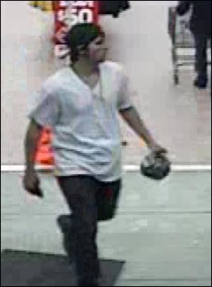 The suspect is described as a white man or teenage boy, of average build, with collar-long hair. He was wearing a baseball-type hat put on backwards, dark pants, white short-sleeve pullover shirt and had a chain around his neck.