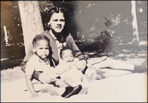 A family portrait taken at Walbridge Park in Toledo shows Ron Jackson's mother, Elizabeth Jackson, with her two children, Beverly, left, and Ron, in the summer of 1941.