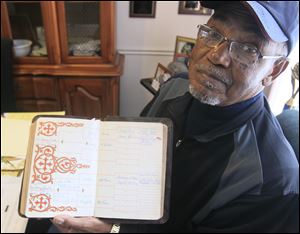 Ron Jackson shows his family Bible. The family tree was entered by his grandmother, Irene Jackson Leak, who married Warnie Leak in Napoleon in 1939.