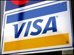  A Visa credit card sign is displayed in a store window in Des Plaines, Illinois, U.S., on Tuesday, Feb. 3, 2008. Visa Inc., the world's largest electronic payments network, will report earnings on Feb. 4. Photographer: Tim Boyle/Bloomberg News