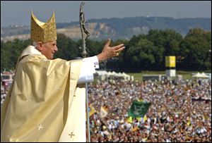 Pope Benedict XVI waves to the crowd at the end of a papal Mass in Regensburg, southern Germany.