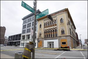 Strong winds caused bricks to fall from this downtown Toledo building, resulting in an intersection being closed.