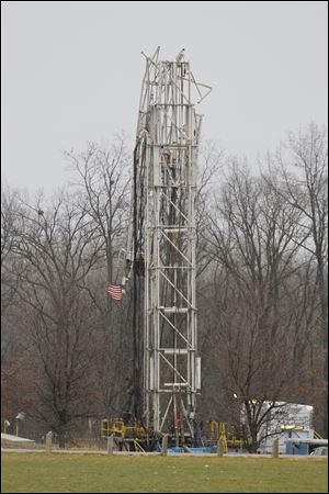 An oil rig is partially collapsed in half at Heritage Park in Adrian, Mich. Lenawee County’s developing oil boom and particularly its potential impact on the Irish Hills and the area inside Adrian’s city limits, will be the subject of a public forum today hosted by the Adrian Dominican Sisters.