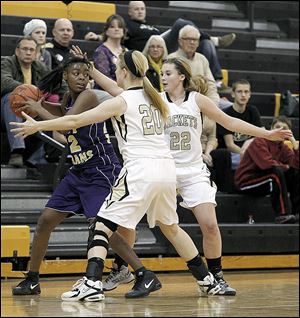 Waite's Janae Kenny is trapped by Perrysburg's Samantha Gremler, left, and Lindy Delong in Monday night's game. The Yellow Jackets turned up the pressure on defense to improve to 19-1 on the season.