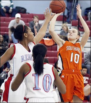Bailey Hejl, who led Southview with 12 points, shoots over Bowsher's Imani Fifer, left, and Isis Dixson in Monday night's game. The Cougars had 10 players score at least four points.