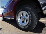  This Tuesday, Oct. 23, 2012 photo, shows a Ford Explorer with Goodyear tires in Jackson, Miss. Goodyear reports earnings, Tuesday, Feb. 12, 2013. (AP Photo/Rogelio V. Solis)