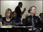  Cathy Aviles, left, principal at Black River Middle School in Sullivan, Ohio, and Ashland County Deputy Angie Hamilton listen during an Active Shooter Training for Educators Course for educators and law enforcement at the Educational Service Center of Lake Erie West.
