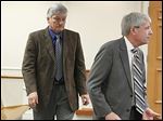  St. John's coach Ed Heintschel, left, appears in Maumee Municipal Court with attorney Richard Hasbrook. A judge rescheduled a pretrial until April 2.
