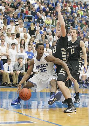 Anthony Wayne's Ose Omofoma, left, drives against Perrysburg's Nate Patterson. Omofoma scored seven of his team-high 16 points during a pivotal span of 71 seconds late.