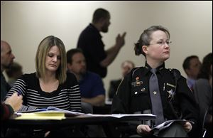 Cathy Aviles, left, principal at Black River Middle School in Sullivan, Ohio, and Ashland County Deputy Angie Hamilton listen during an Active Shooter Training for Educators Course for educators and law enforcement at the Educational Service Center of Lake Erie West.