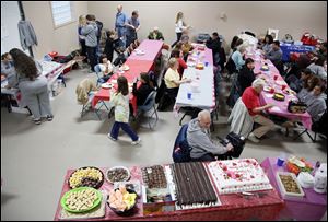 People eat during a fundraiser sponsored by the Northwest Ohio Great Dane Meetup and Rescue Feb 9, in Waterviile. A new website helps people meet up with folks who share similar interest and hobbies. Some groups travel together, others meet up for event, activities, sports and more.