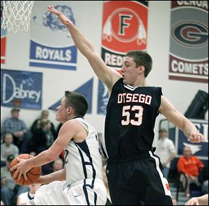 Otsego’s  A.C. Limes tries to stop a shot in a game against Lake. Limes set the school record for points in a game (41) this season and is also the career leader with 1,138.