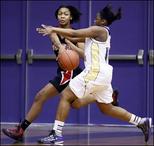 Toriana Easley of Rogers makes a pass against Waite's Ramiah Henry. Easley, a 5-foot-11 junior, averages 9.1 points.