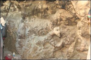 A rock carving by a Jamaican artist is part of a roadside gallery.