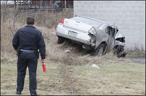 Toledo Police investigate a crash on the Anthony Wayne Trail at City Park Avenue in South Toledo early today.